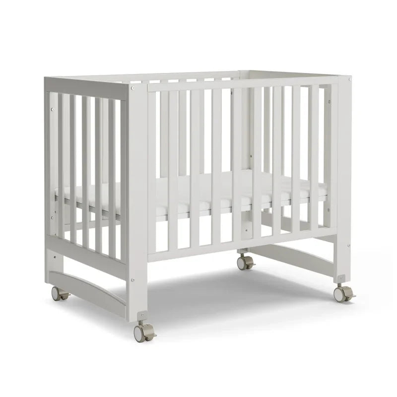 6-in-1 Adjustable Portable Mini White Crib including Mattress and made of New Zealand PInewood.