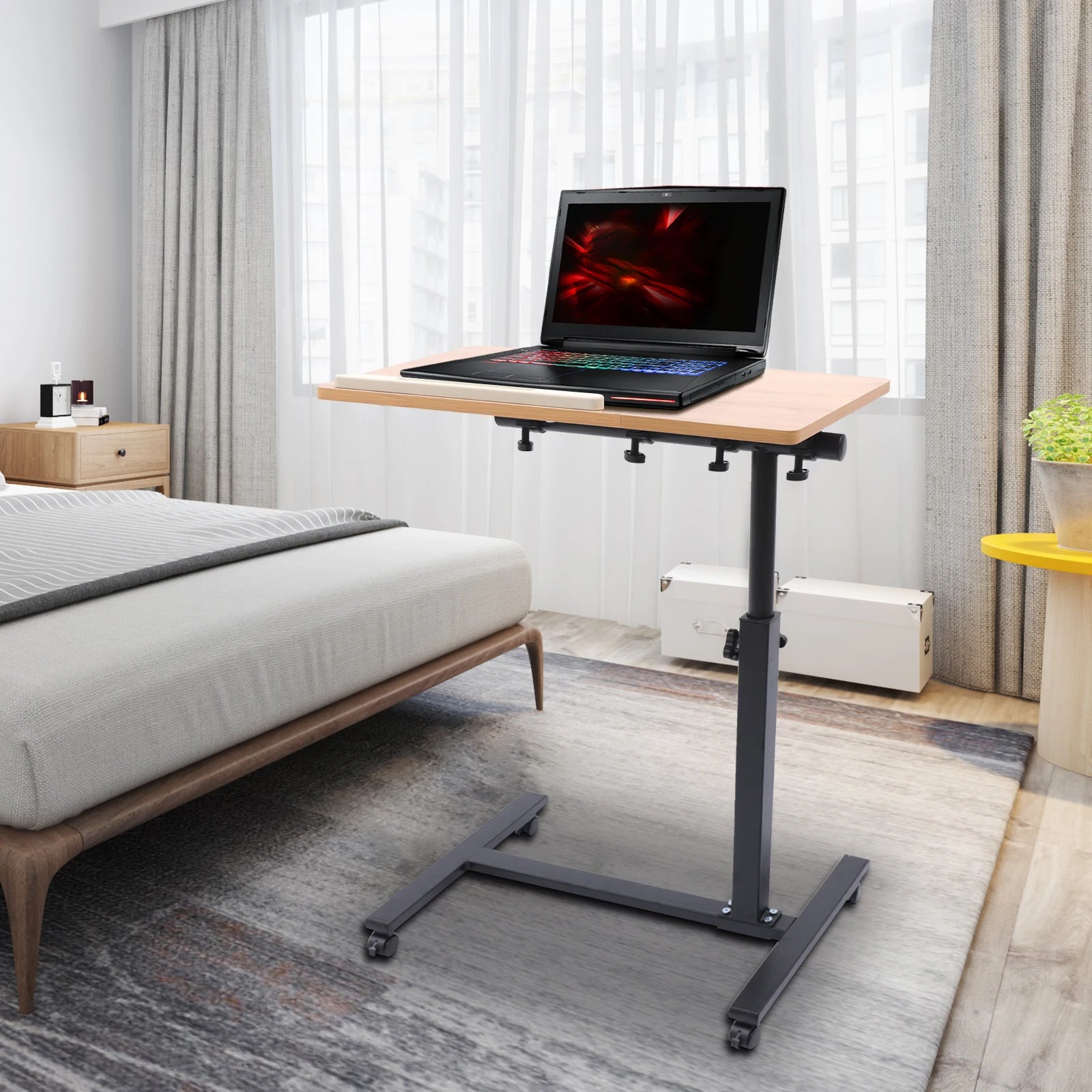 Adjustable Rolling Laptop Desk with 360° Rotating Tabletop.