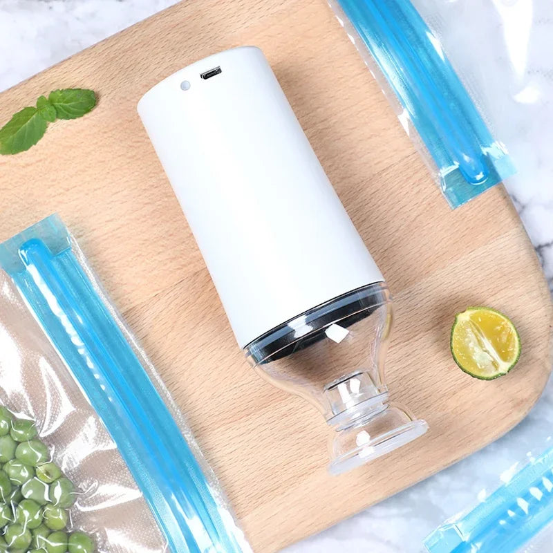 Reusable Electric Handheld Vacuum Sealer Pump with Zipper Bags for Food Storage or Sous Vide Bags.