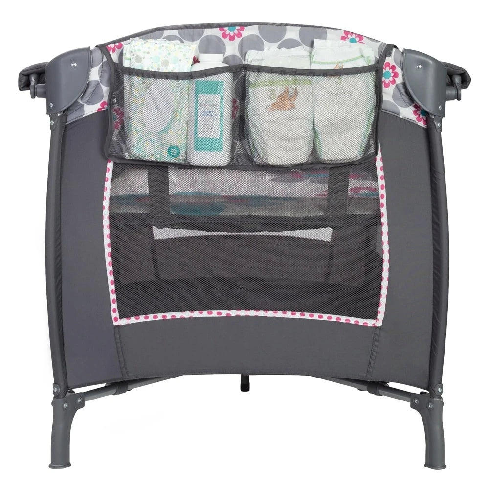 Lil' Snooze™ Deluxe II Nursery Center® Play yard, Daisy Dots Cozy napper with canopy and 2 plush toys