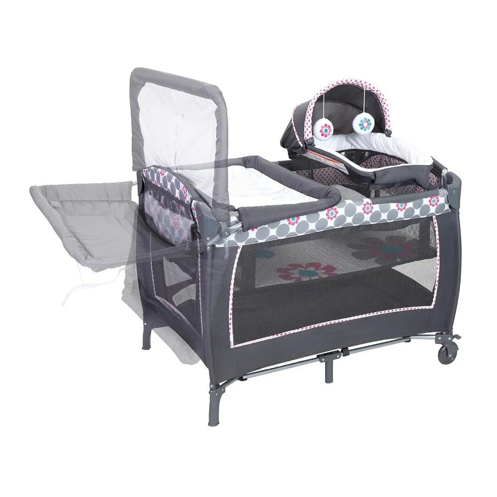 Lil' Snooze™ Deluxe II Nursery Center® Play yard, Daisy Dots Cozy napper with canopy and 2 plush toys