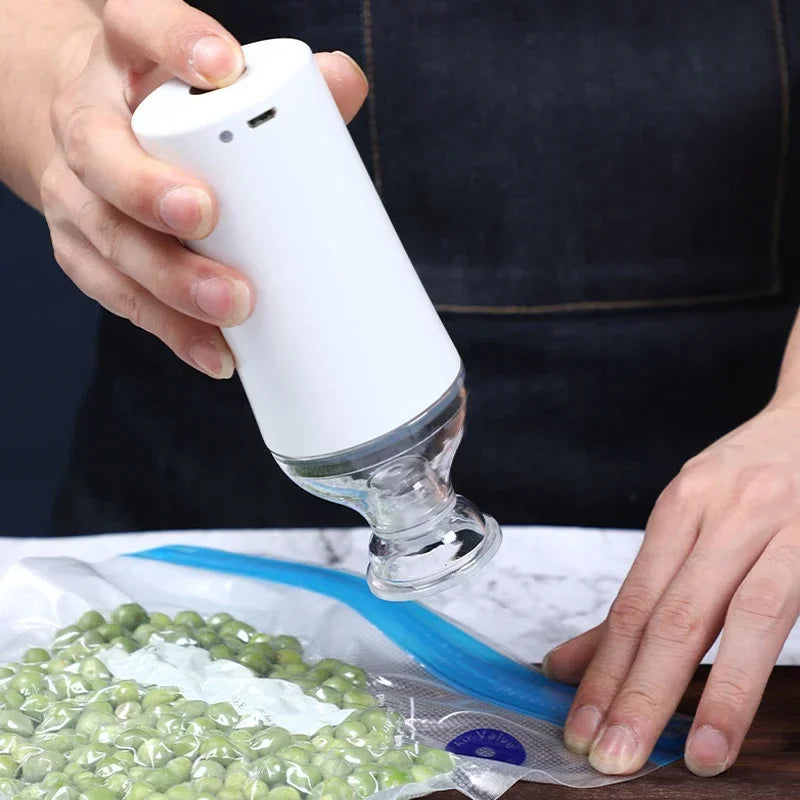 Reusable Electric Handheld Vacuum Sealer Pump with Zipper Bags for Food Storage or Sous Vide Bags.