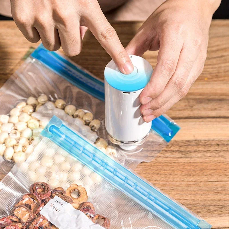 Reusable Electric Handheld Vacuum Sealer Pump with Zipper Bags for Food Storage or Sous Vide Bags.