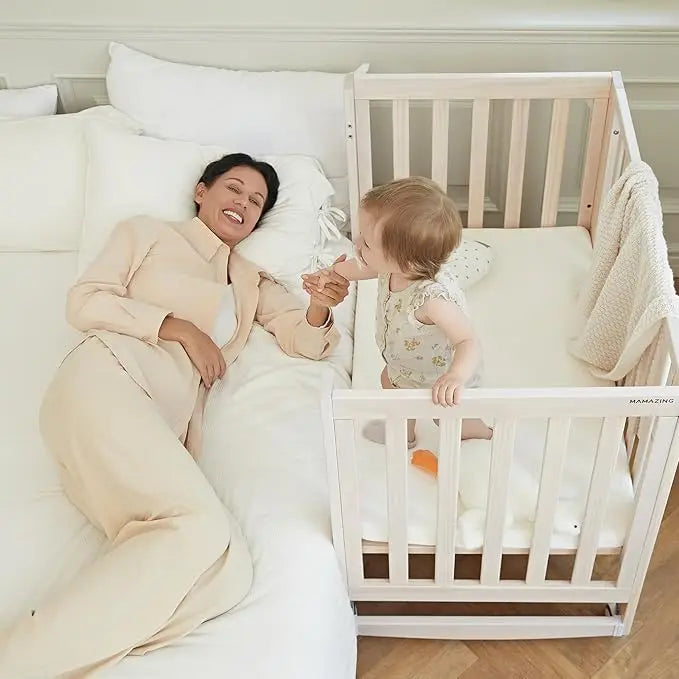 11-in-1 Convertible Baby Crib With Removable Wheels, Washed Natural New Zealand Pinewood Finish, and 4 Mattress Heights.