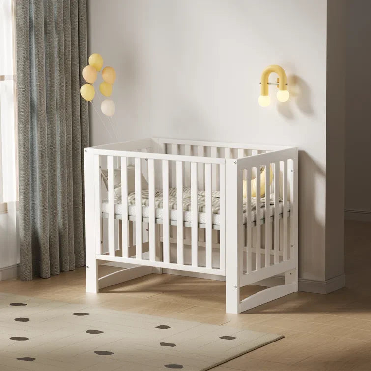 6-in-1 Adjustable Portable Mini White Crib including Mattress and made of New Zealand PInewood.